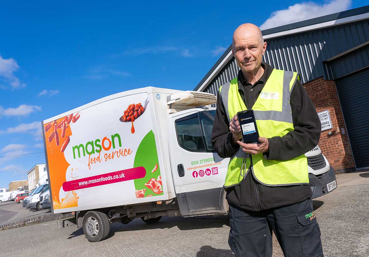 Mason foods employee holding phone with Podfather login screen