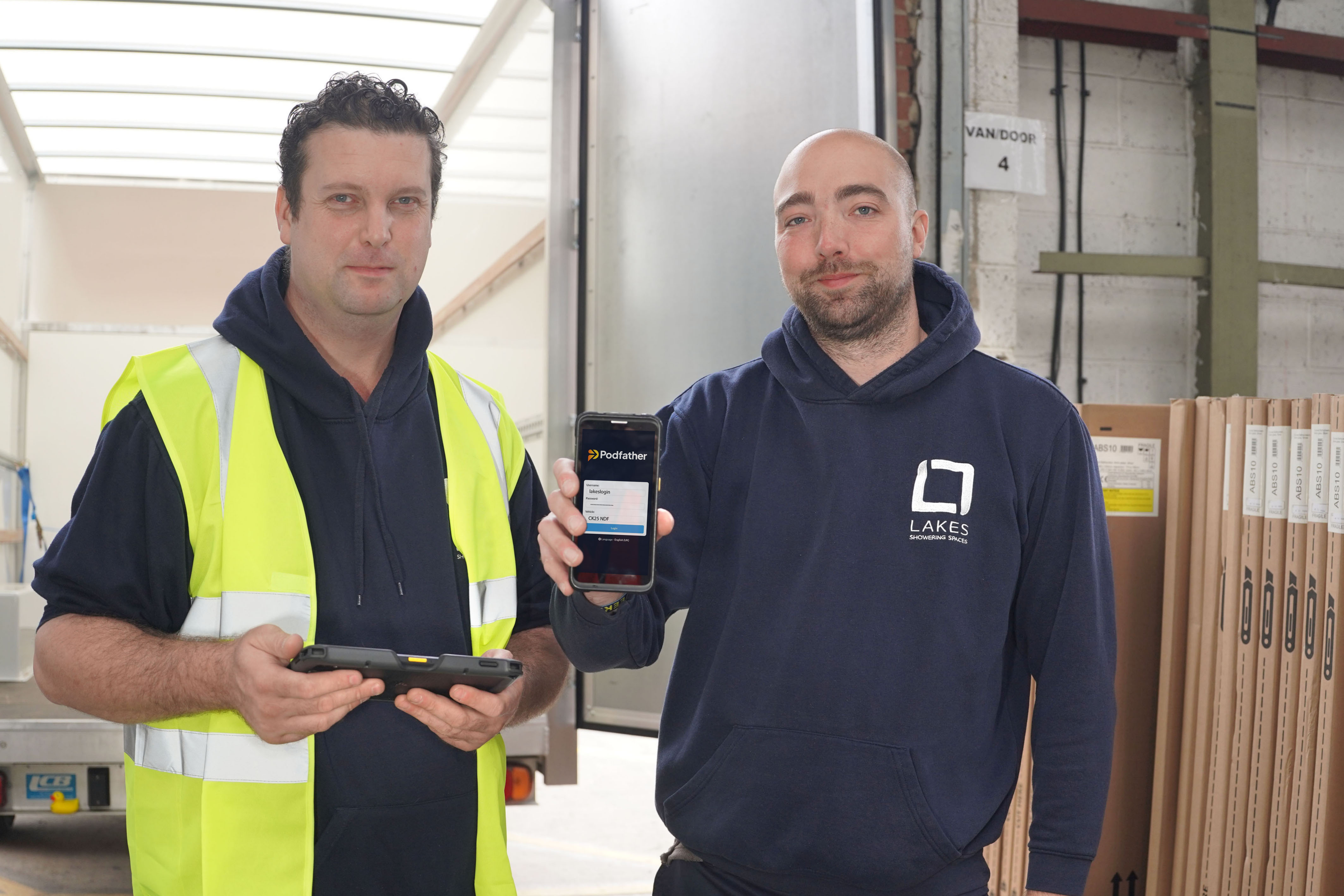 Lakes Employee holding phone with Podfather system
