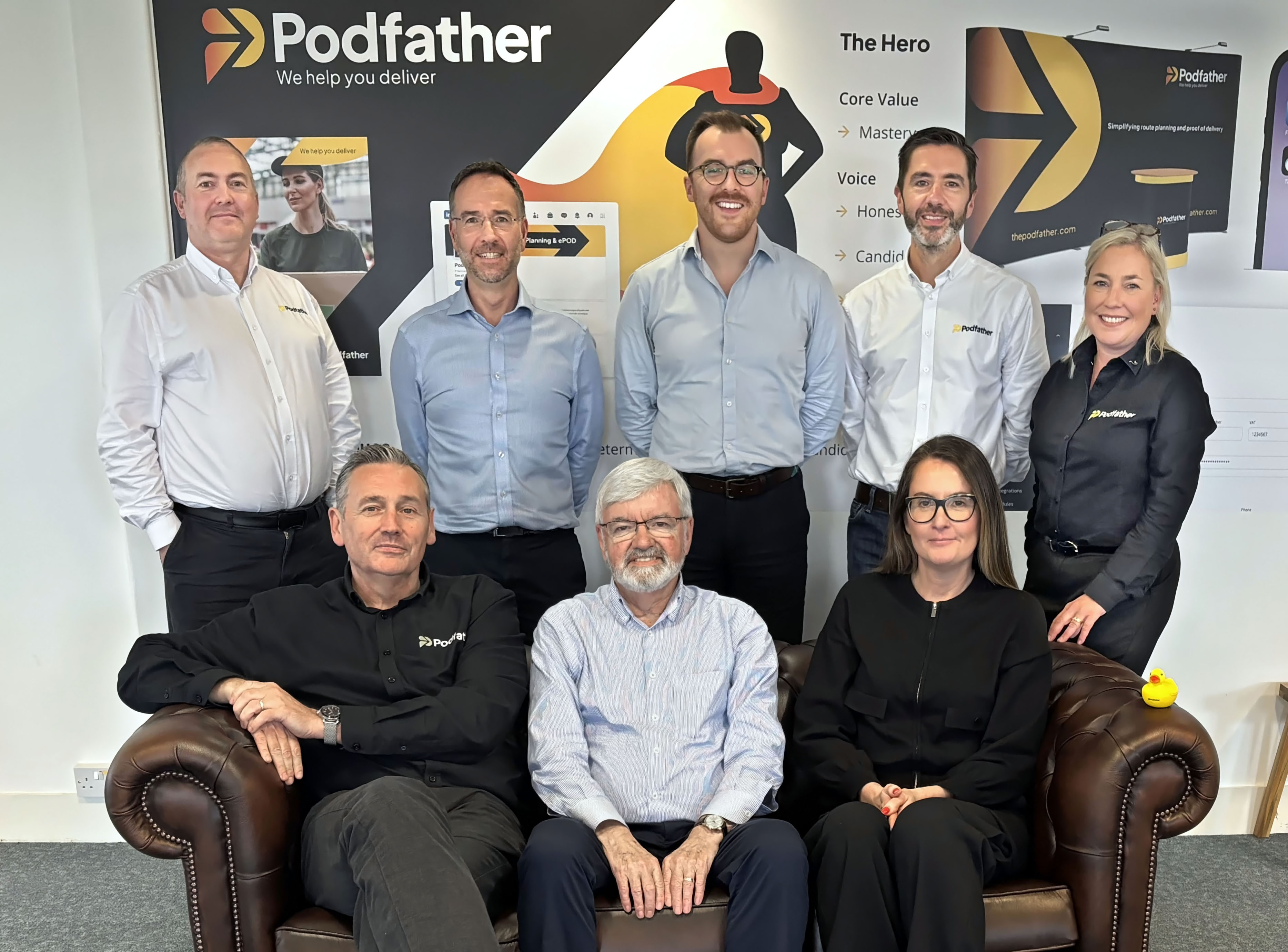 Group of smiling people sitting and standing