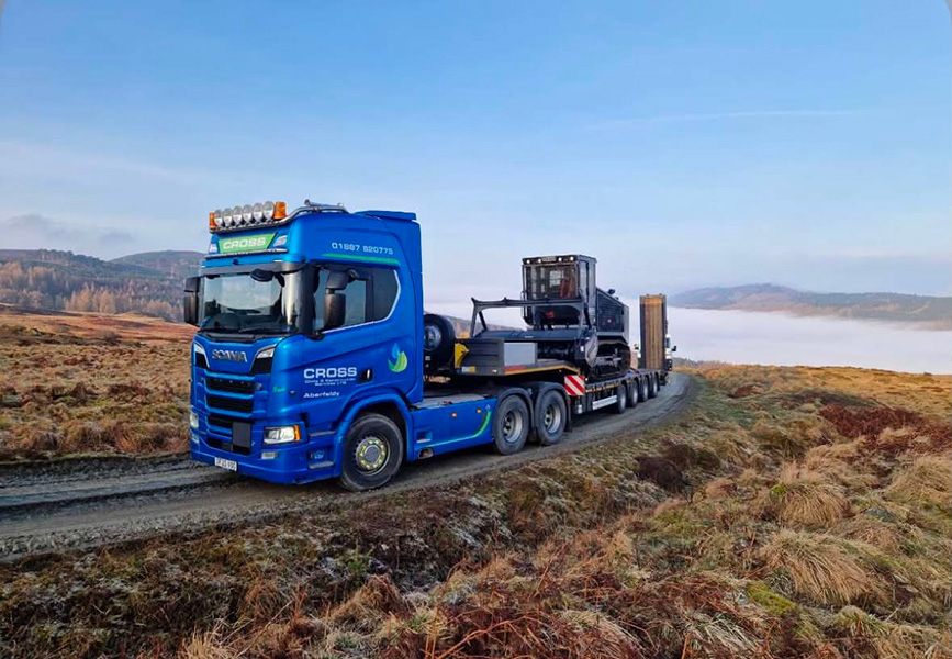 Blue heavy goods vehicle photographed in a Scottish Highland setting